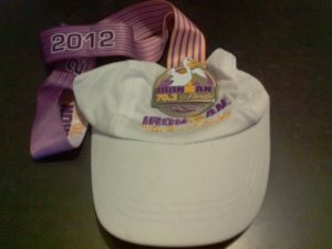 IM_703_FL_Finisher_Medal Finisher Medal and Cap